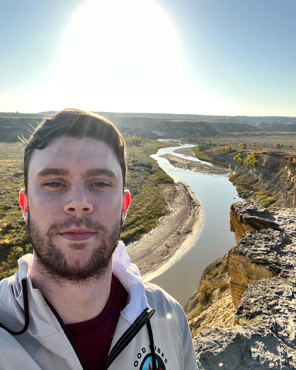 Christian Paschold at sunset above a river canyon